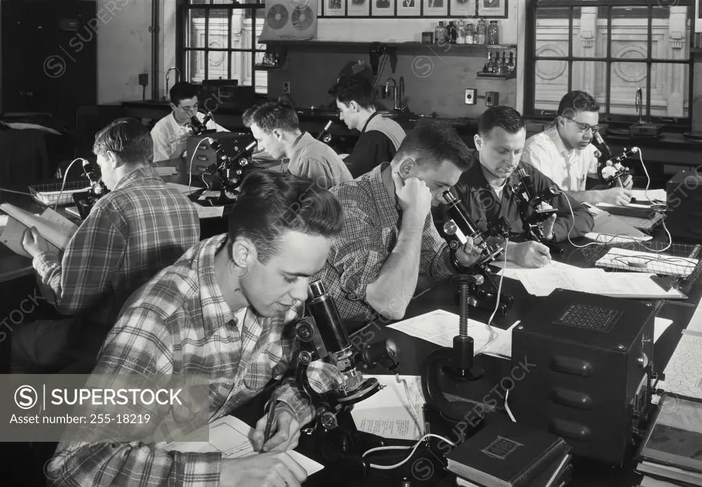 Vintage Photograph. Students of Stevens Institute of Technology examining structures of metal specimens
