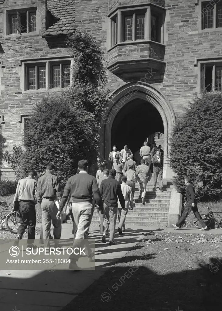 Vintage photograph. Group of people walking towards a university building, Holder Hall, Princeton University, Princeton, New Jersey, USA