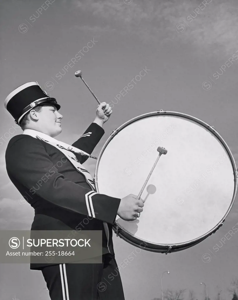 Marching band member playing drum