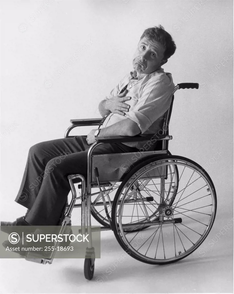 Portrait of a mid adult man sitting on a wheelchair