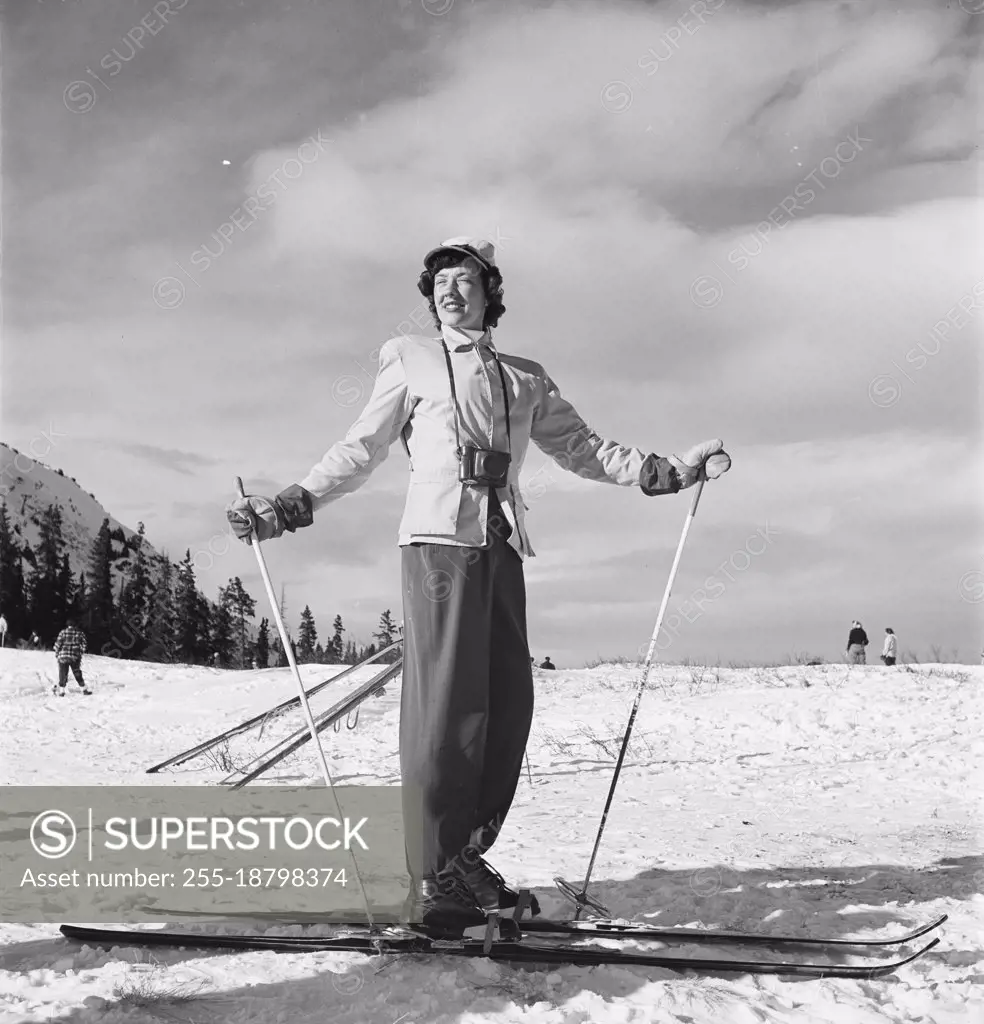 Vintage photograph. Woman on skiis in snow. Model released