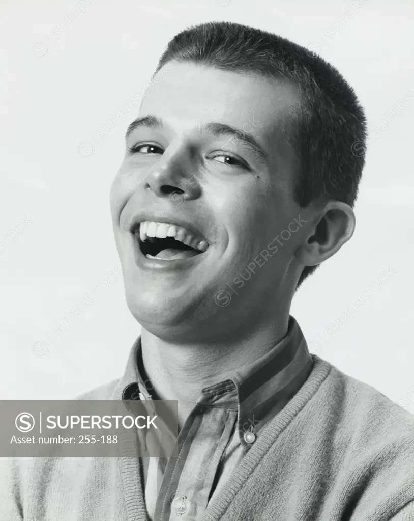 Portrait of a teenager boy laughing