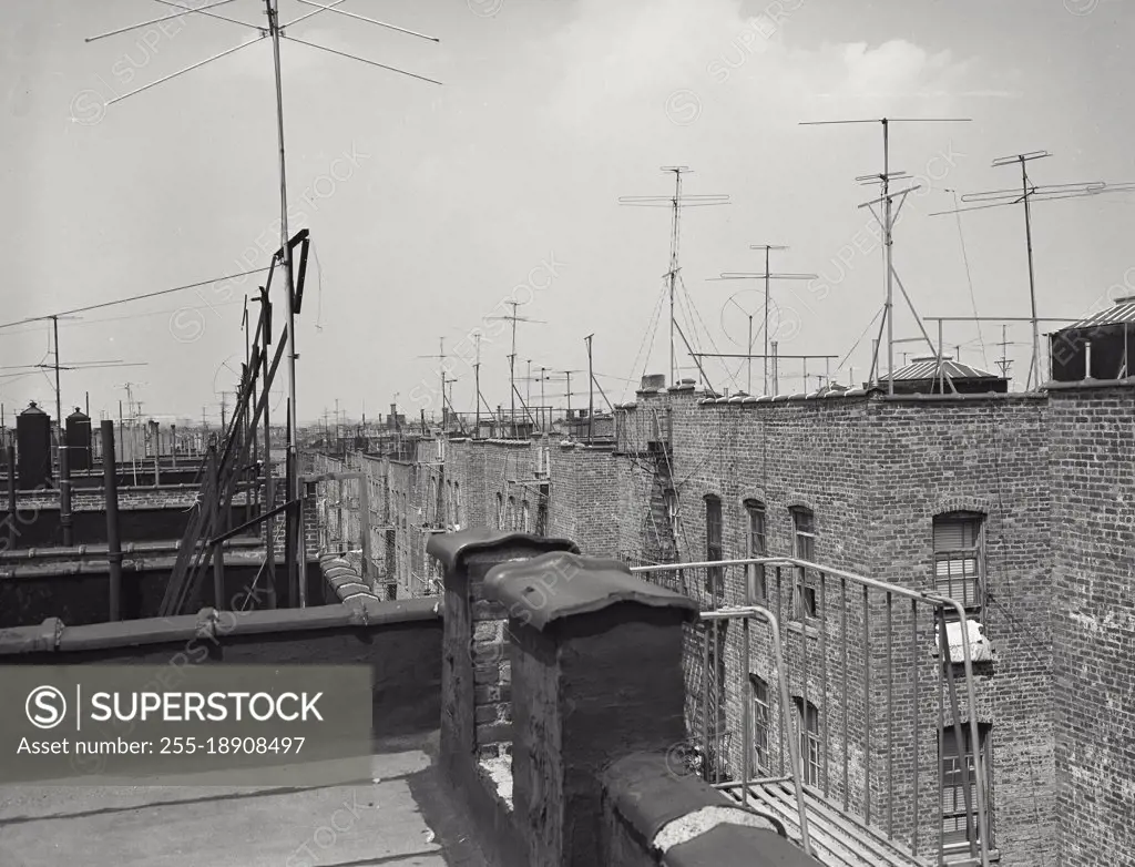 Vintage photograph. Television antennas on Bronx building rooftops