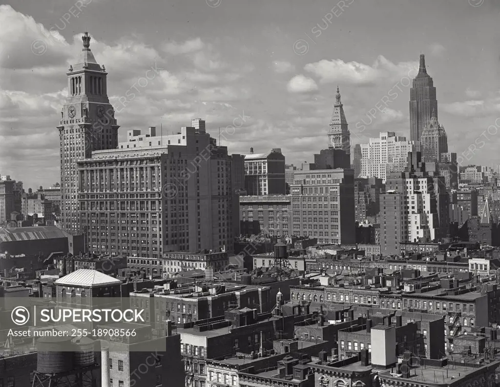 Vintage photograph. Looking northwest toward Mid Town skyline from the vicinity of East 14th Street, showing Consolidated Edison Building on the left
