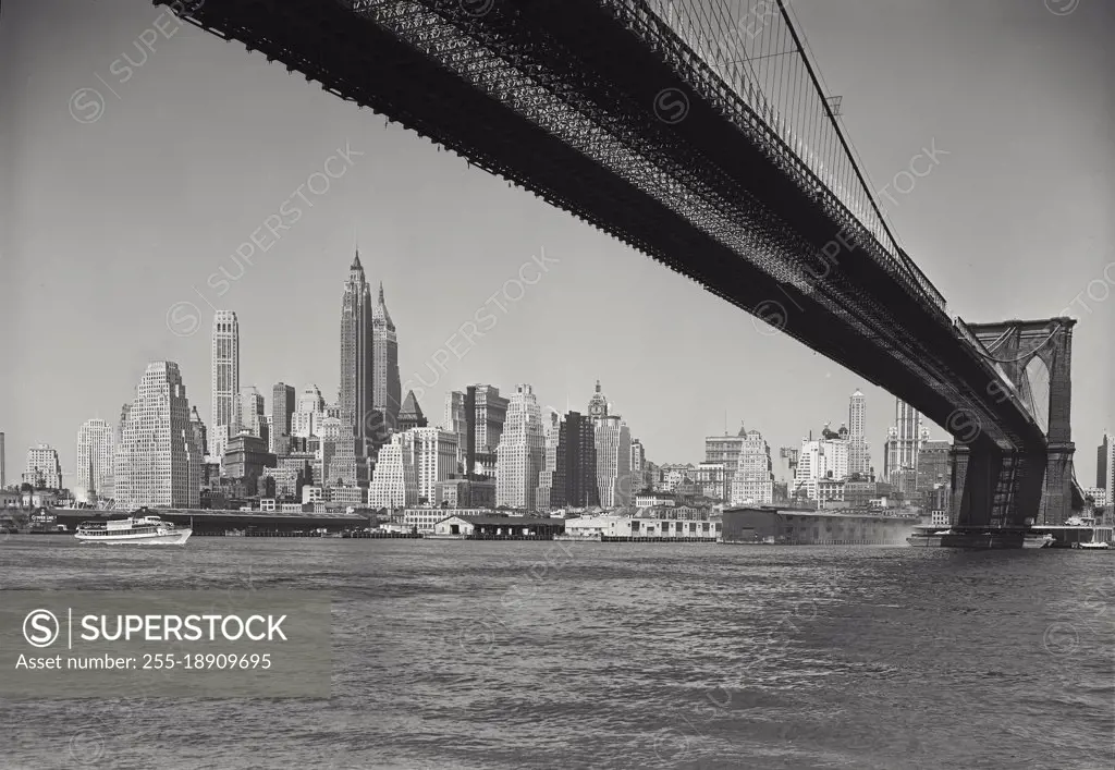 Vintage photograph. new york skyline as seen from under brooklyn bridge