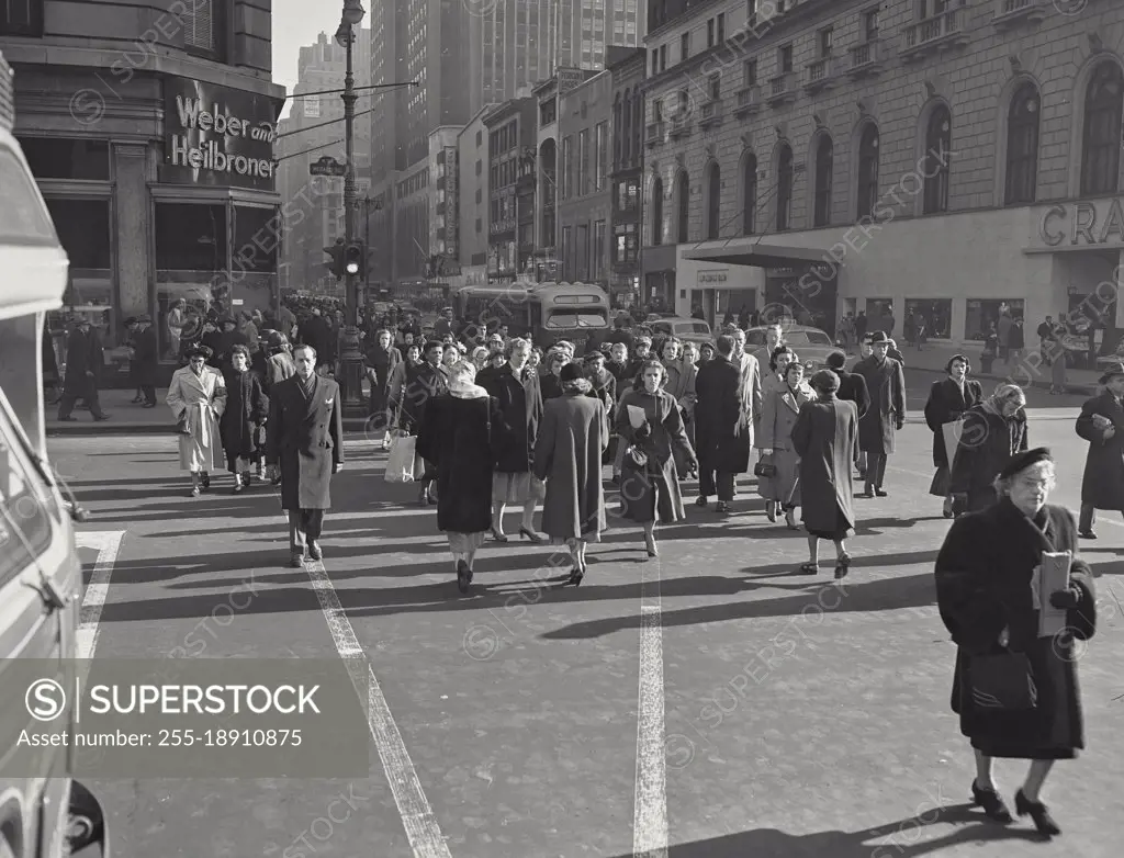 Vintage photograph. Pedestrians crossing the street near 34th Street, New York City