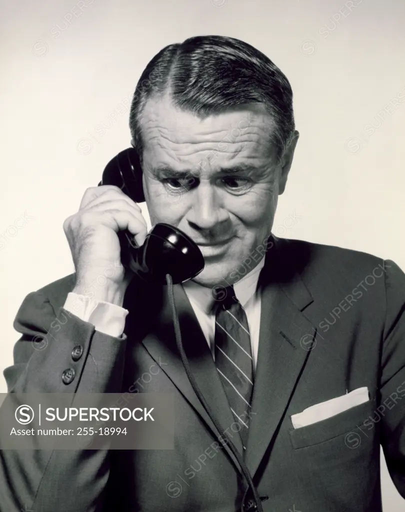 Close-up of a businessman using a telephone