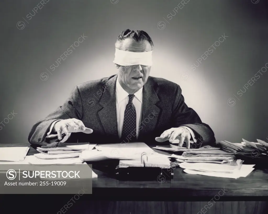 Close-up of a businessman with his eyes blindfolded