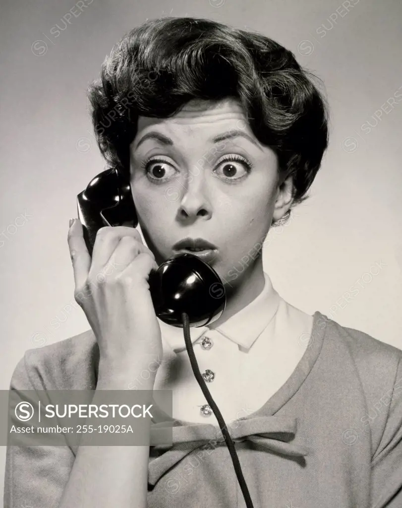 Close-up of a young woman using a telephone