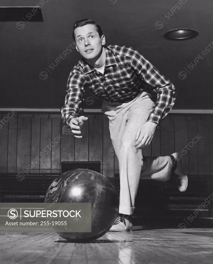 Young man bowling