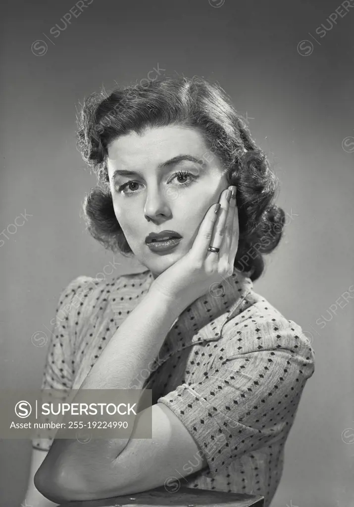 Vintage photograph. Woman in collared blouse smiling at camera