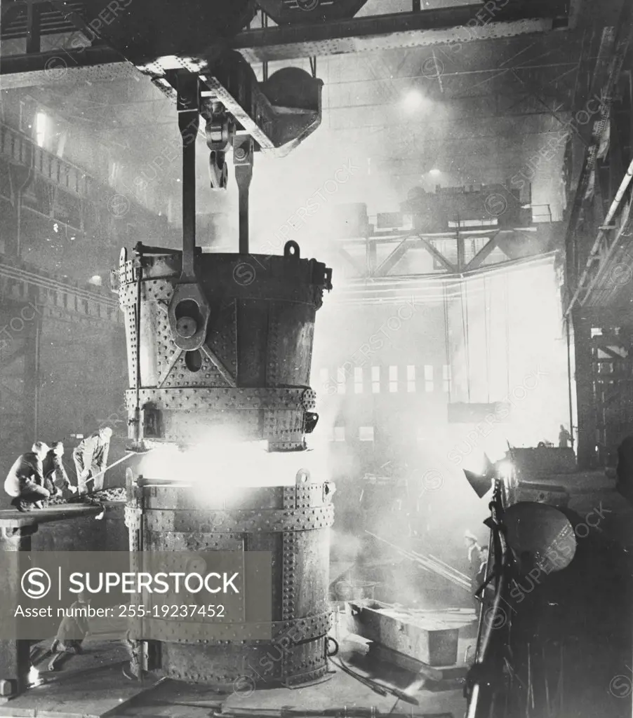 Vintage photograph. Pouring steel in a factory in Sheffield, England