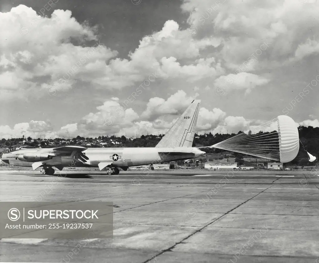 Vintage photograph. The Boeing YB-52 Stratofortress slows to a halt with the aid of its drag chute