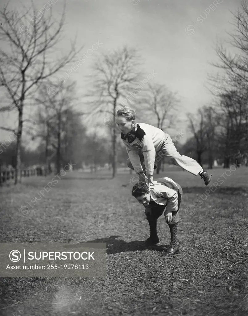 Vintage photograph. Boys playing leap frog