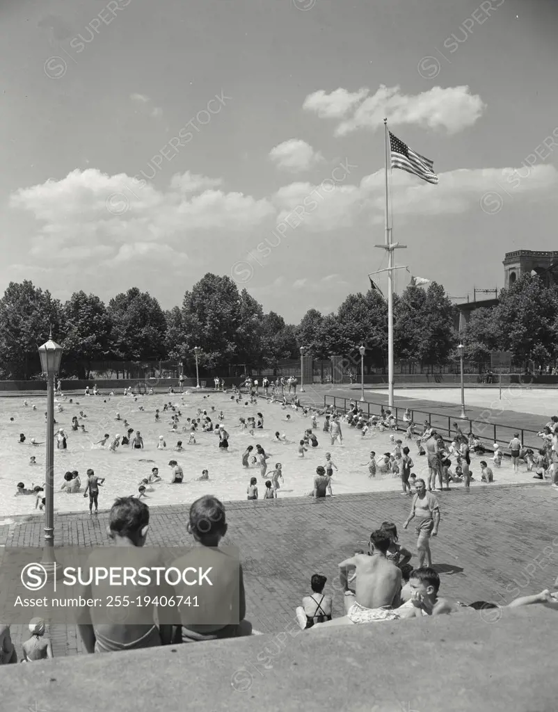 Vintage photograph. Astoria Park Pool. New York City. People playing in public pool