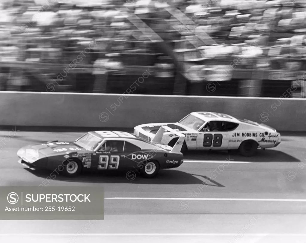 Two stock cars on a racing track