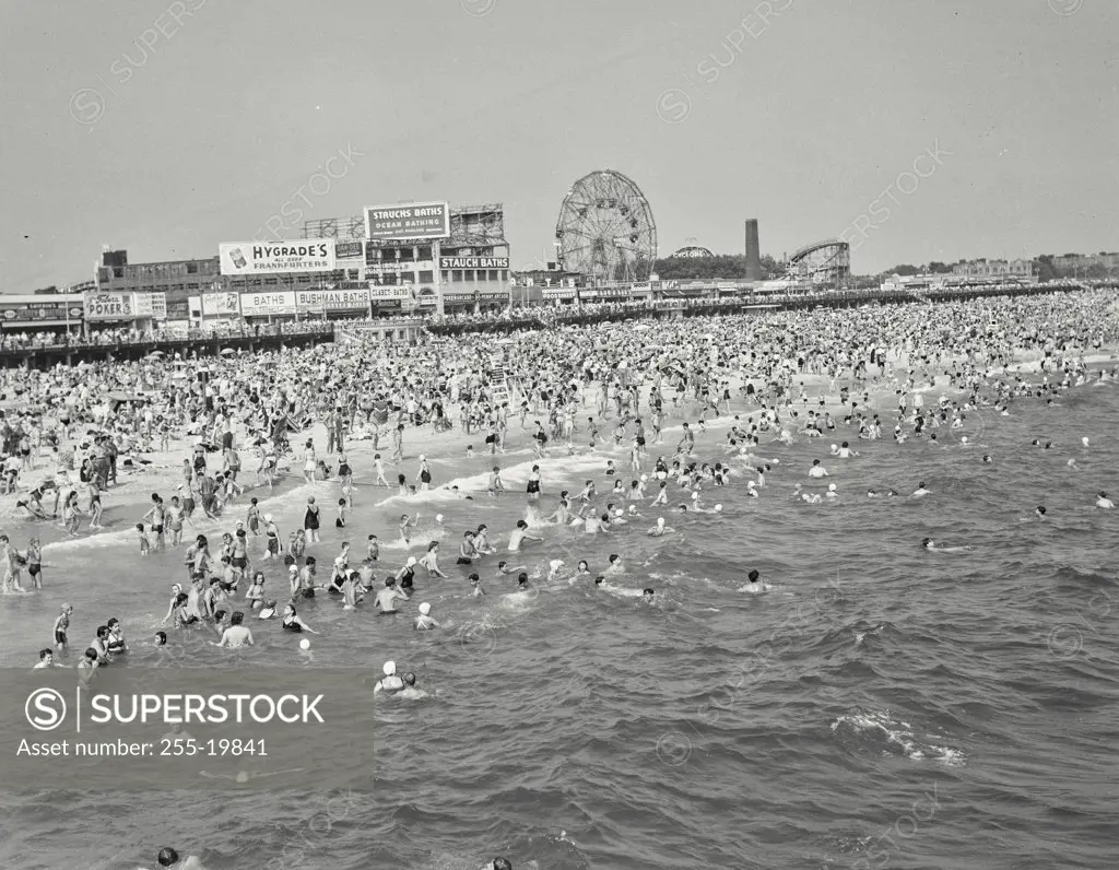 Vintage photograph. High angle view of tourists on the beach, Coney Island, New York City, New York State, USA