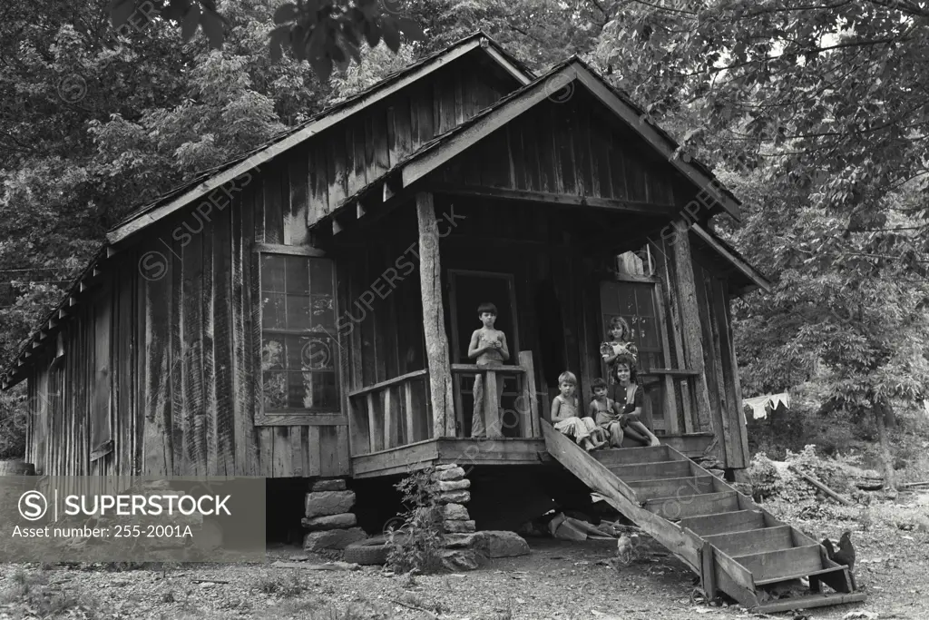 Vintage Photograph. Boys and girls in the porch of a house, Ozark Mountains, Arkansas, USA