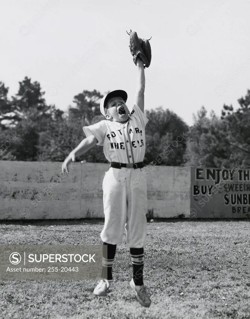 Baseball player jumping in a baseball field
