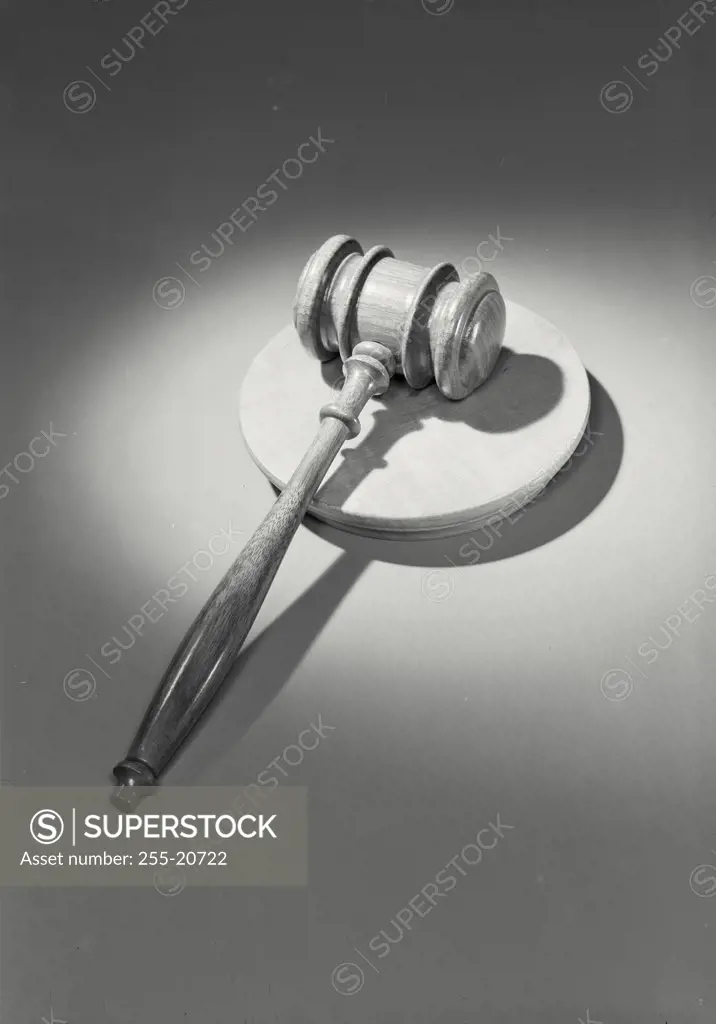 Vintage photograph. High angle view of gavel resting on wooden block