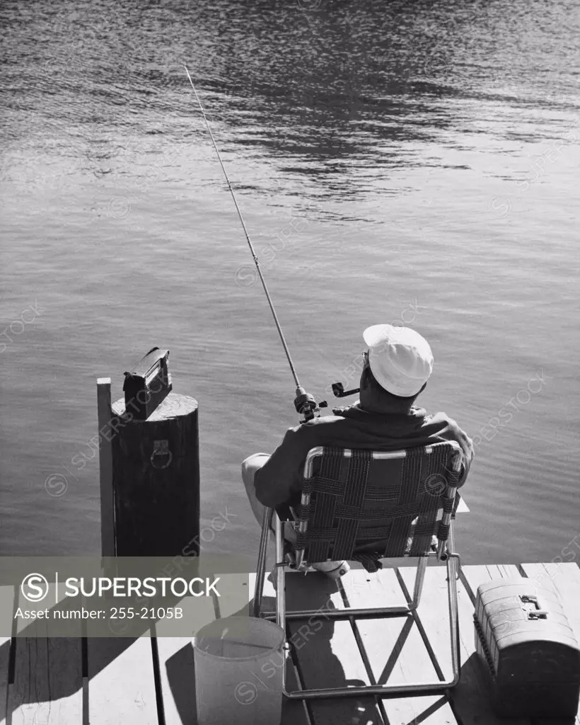 Rear view of man fishing