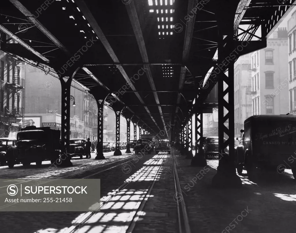 Vintage Photograph. View under 3rd Avenue elevated at 47th St showing cars under bridge.