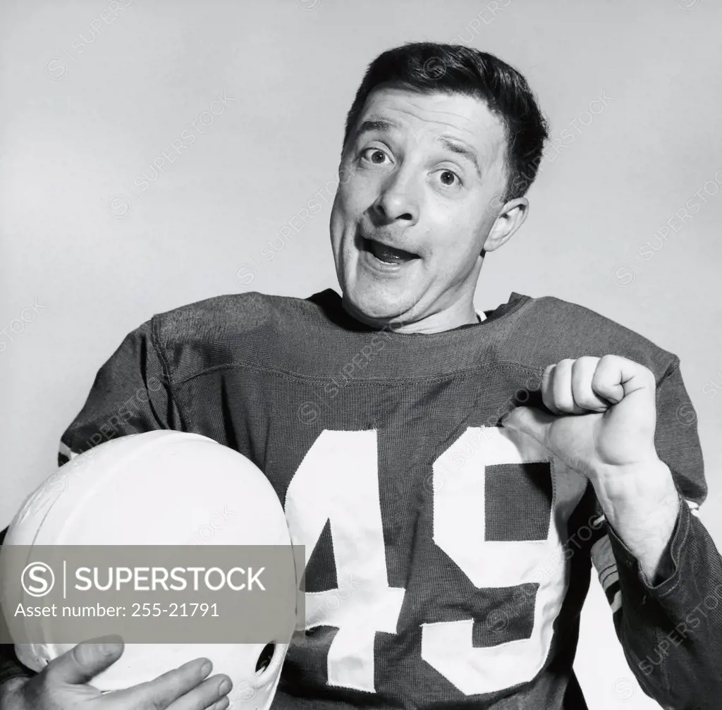 Portrait of a football player pointing at himself