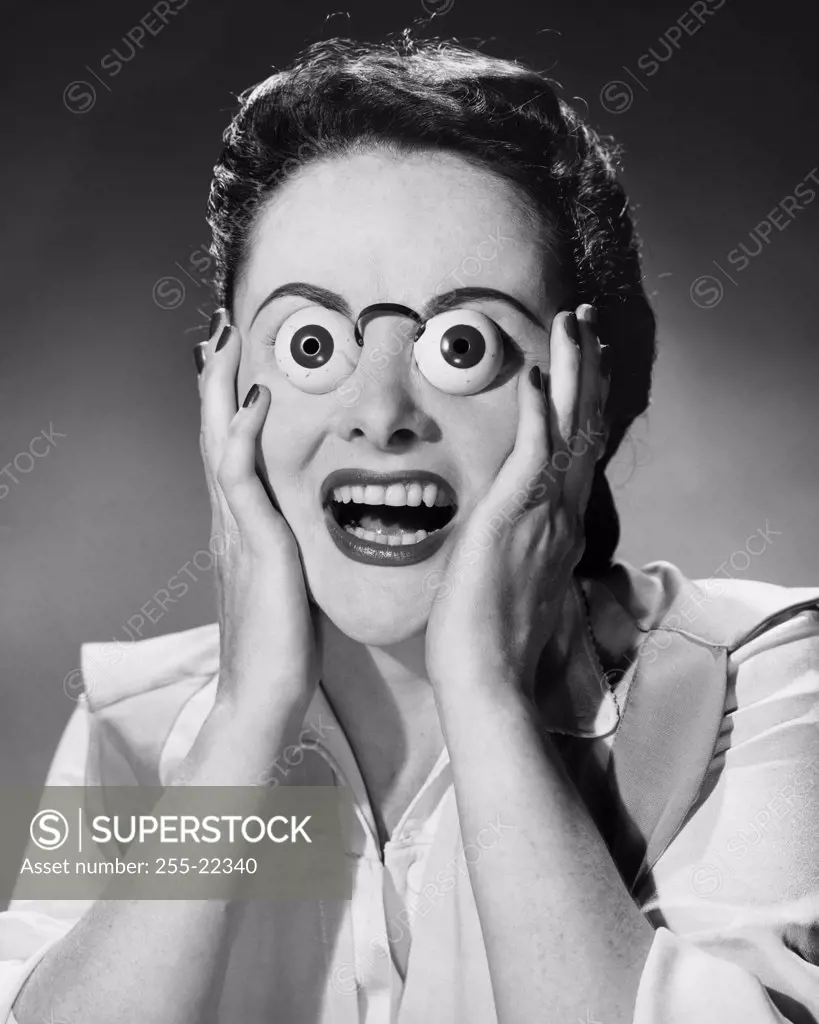 Surprised woman with funny glasses