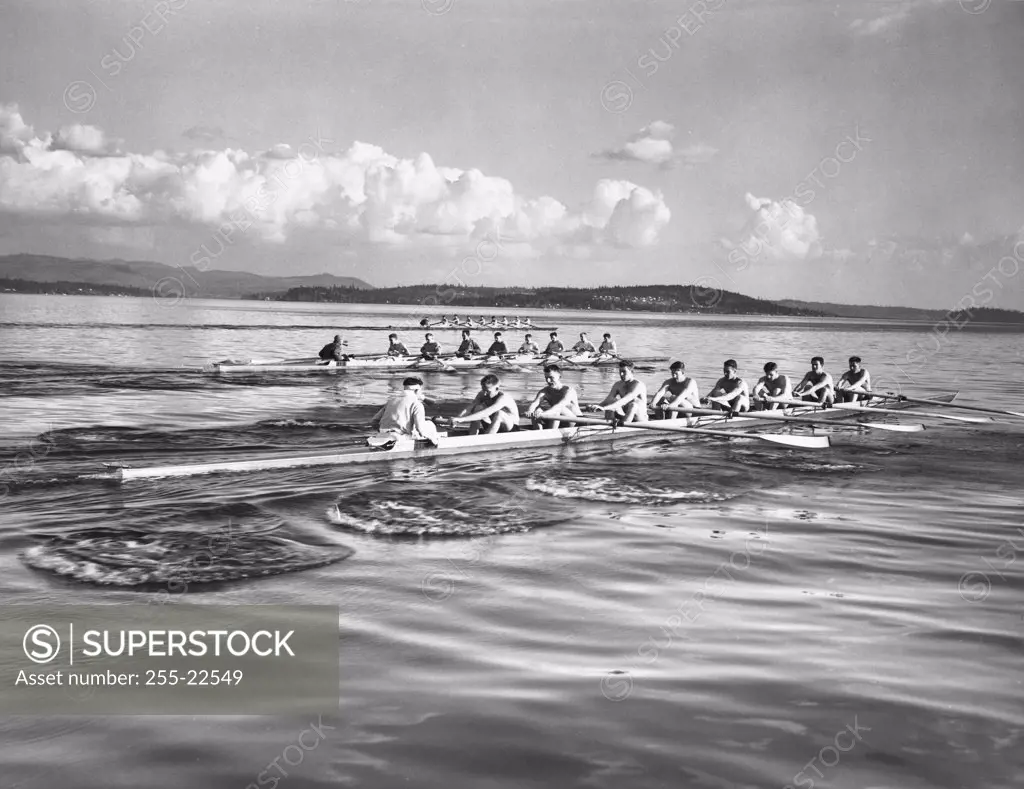 Group of men rowing rowboats in a sweep rowing race, Lake Washington, Washington, USA