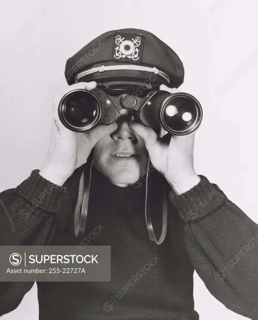 Sailor looking through binoculars