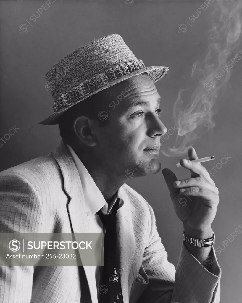 Close-up of a mid adult man smoking a cigarette