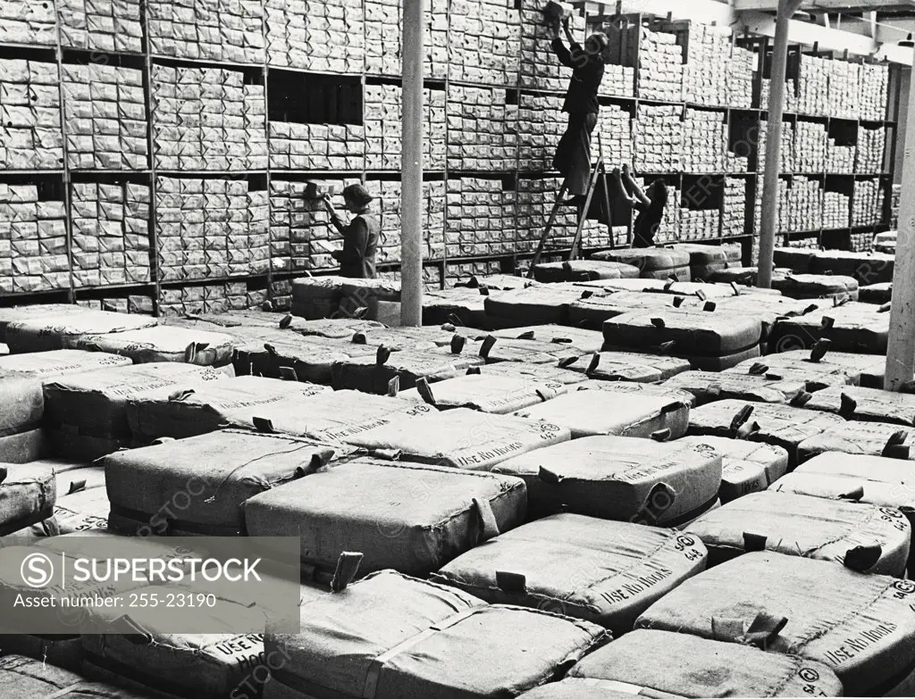 Vintage photograph. Sales warehouses of a large Lancashire cotton mill in England. All varieties of cotton cloth are stored here, the bales are ready for export.