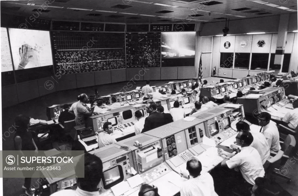 Group of scientist working in a control room, NASA Mission Control Center, Houston, Texas, USA