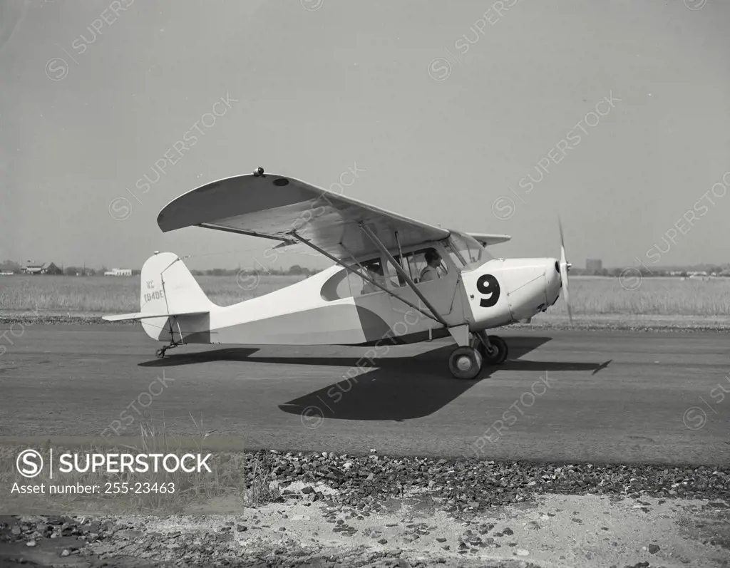 Vintage photograph. Aeronca Champion Plane on a runway at Bendix Air Terminal