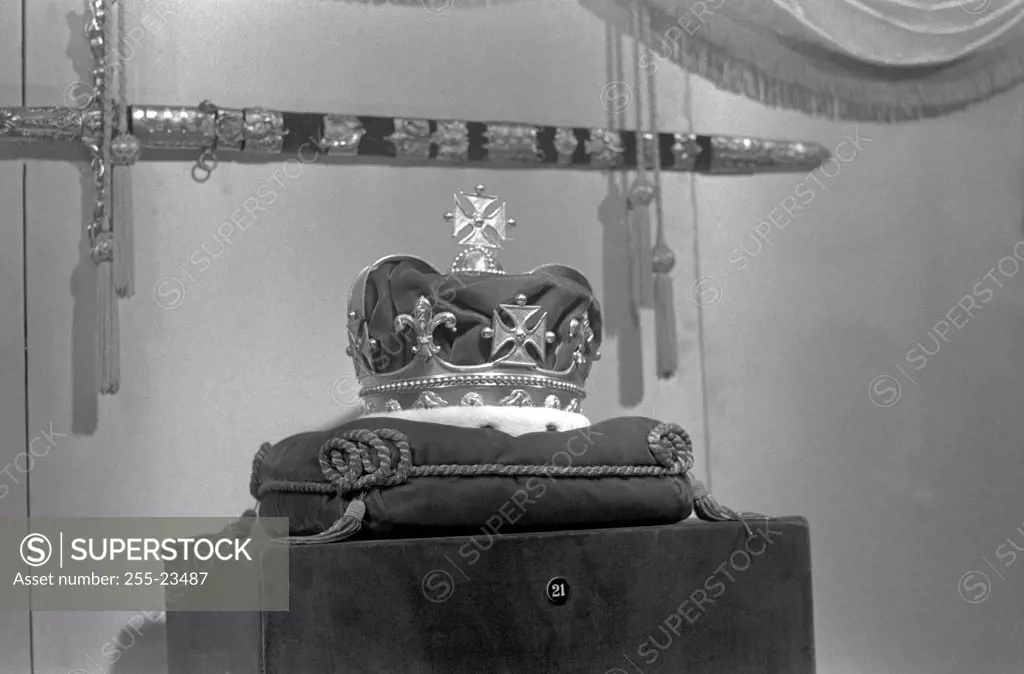 Crown and ornate sword in museum exhibition