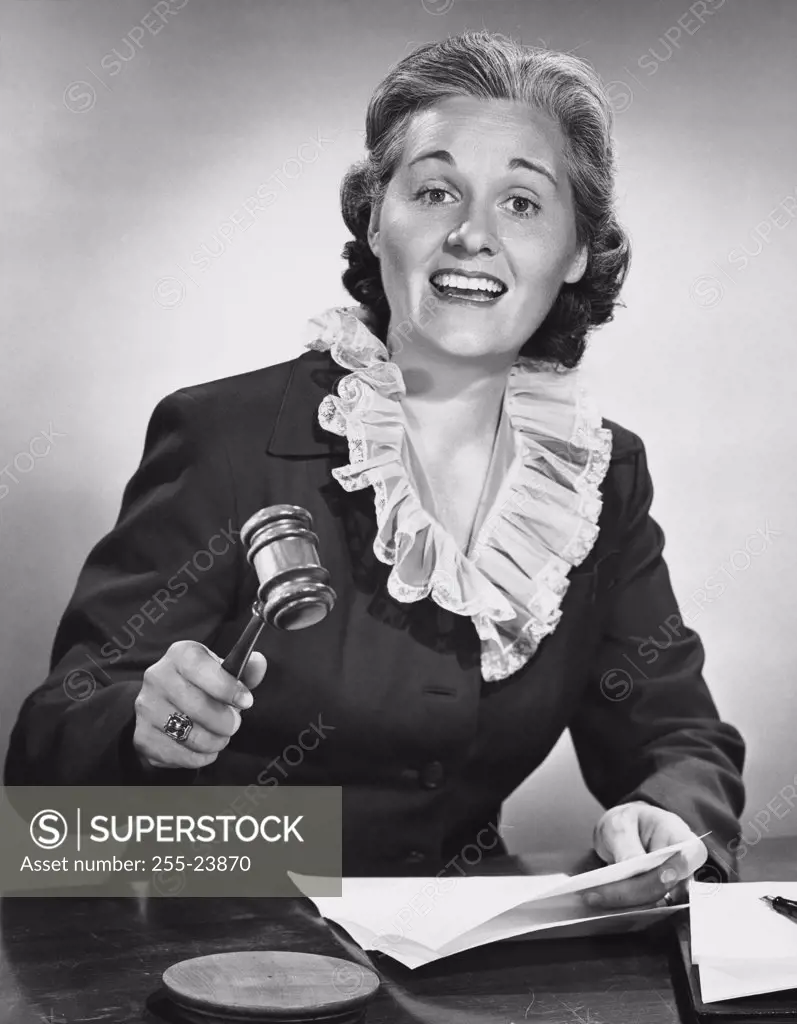 Female judge holding a gavel