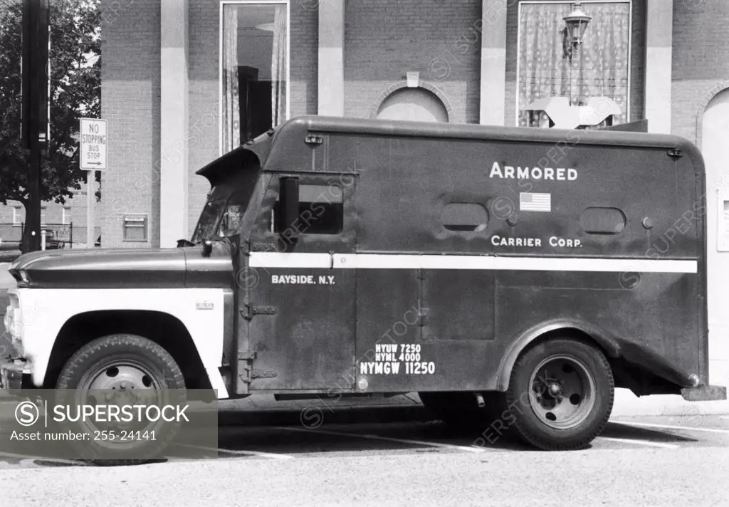 Armored truck in front of a building