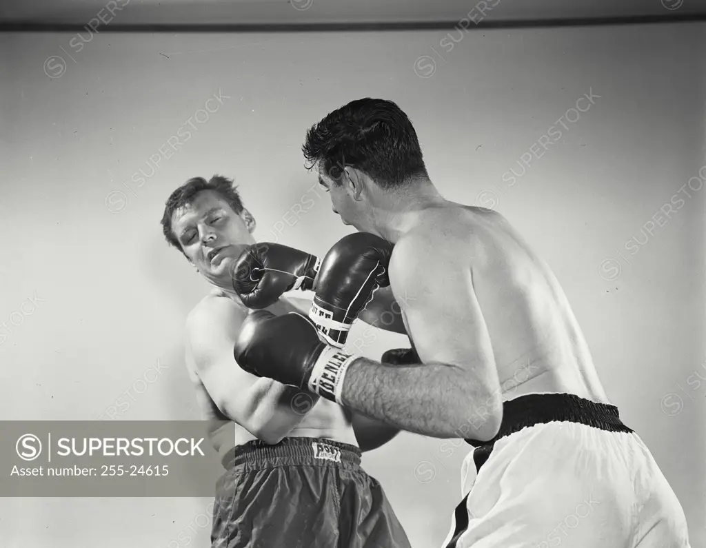 Vintage Photograph. Boxers wearing gloves in brawl. Frame 2