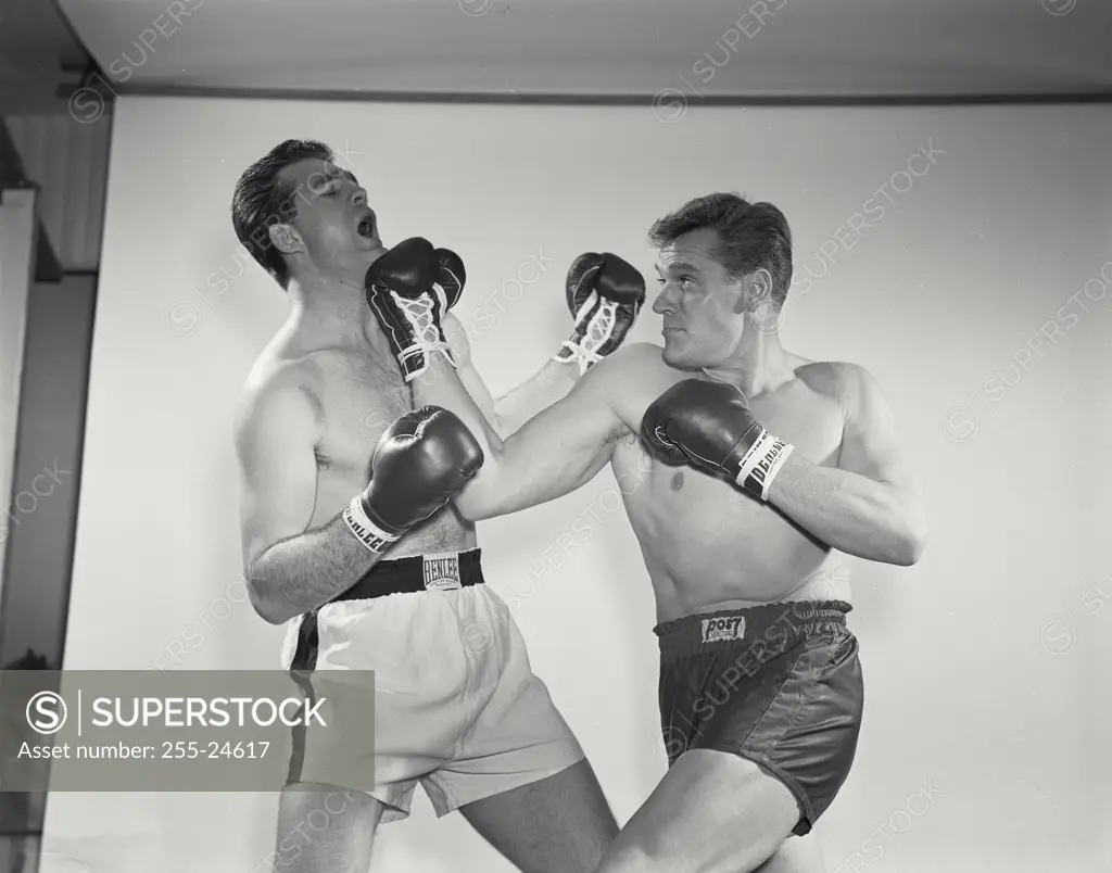 Vintage Photograph. Boxers wearing gloves in brawl. Frame 5