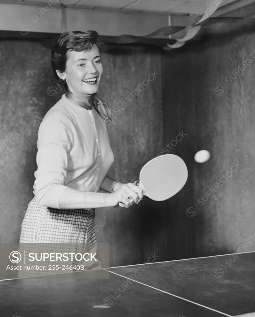 Young woman playing table tennis