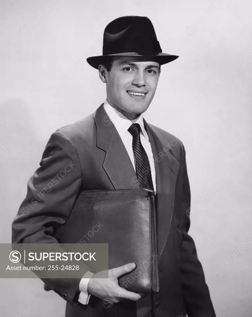 Portrait of a businessman holding a file