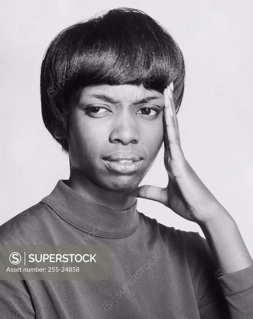 Close-up of a young woman suffering from a headache