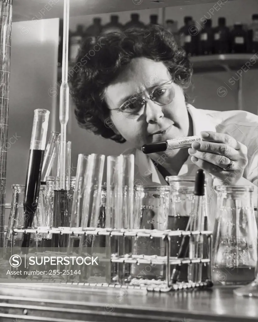 Close-up of a mid adult woman holding a test tube in a laboratory