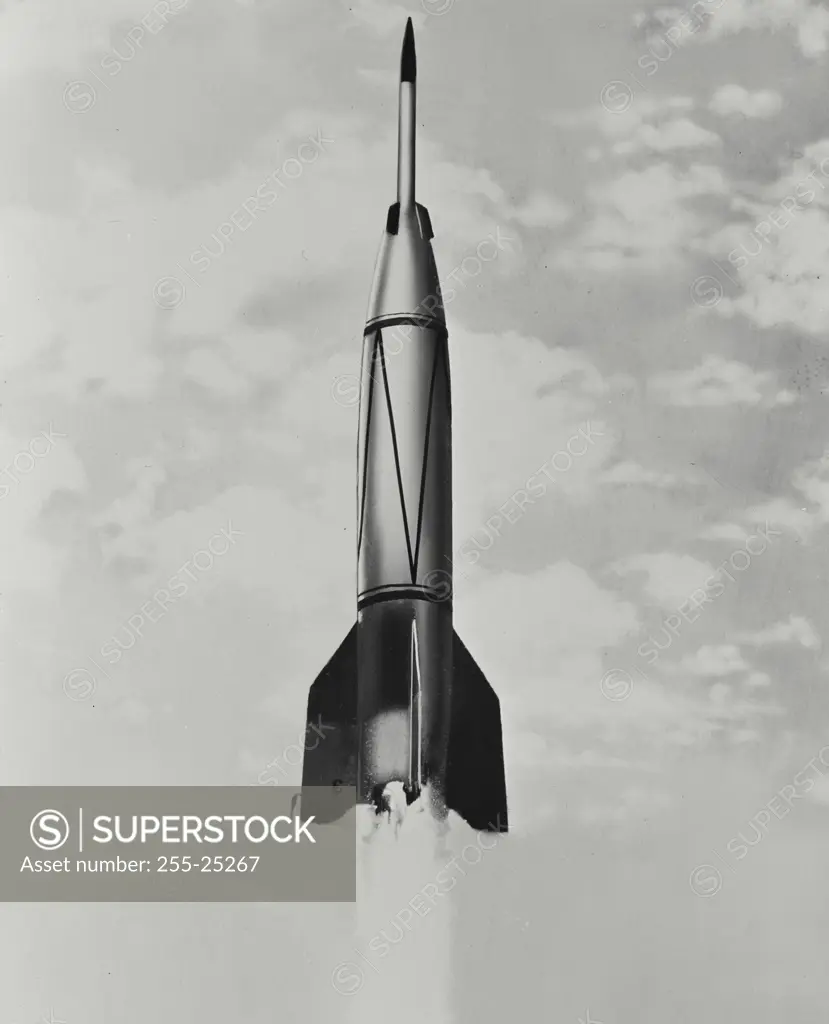 Vintage photograph. A two stage "Bumper" rocket takes off at the White Sands, New Mexico Proving Grounds. The thin pencil like nose is the "WAC Corporal" which is released after the missile is approximately 20 miles high. It continues on its own power and has attained a record 250 mile altitude.