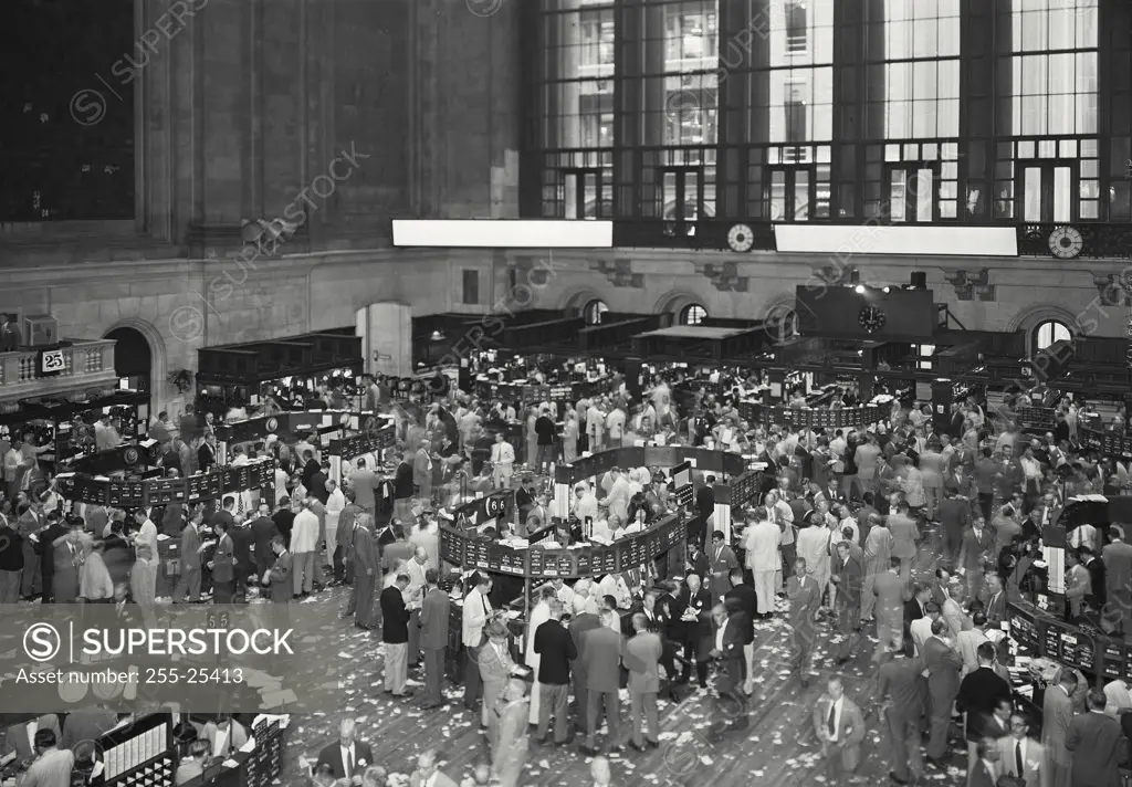 Vintage photograph. High angle view of a group of people at the trading floor of the New York Stock Exchange