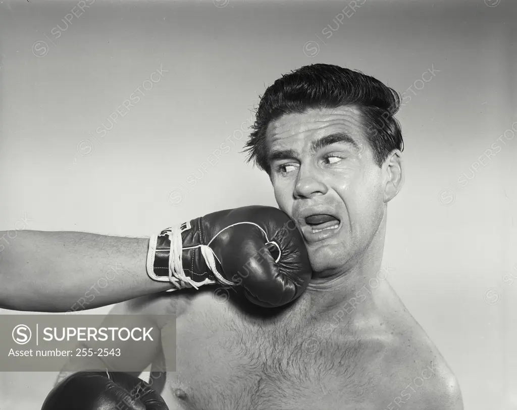 Vintage Photograph. Boxer being punched in face. Frame 1