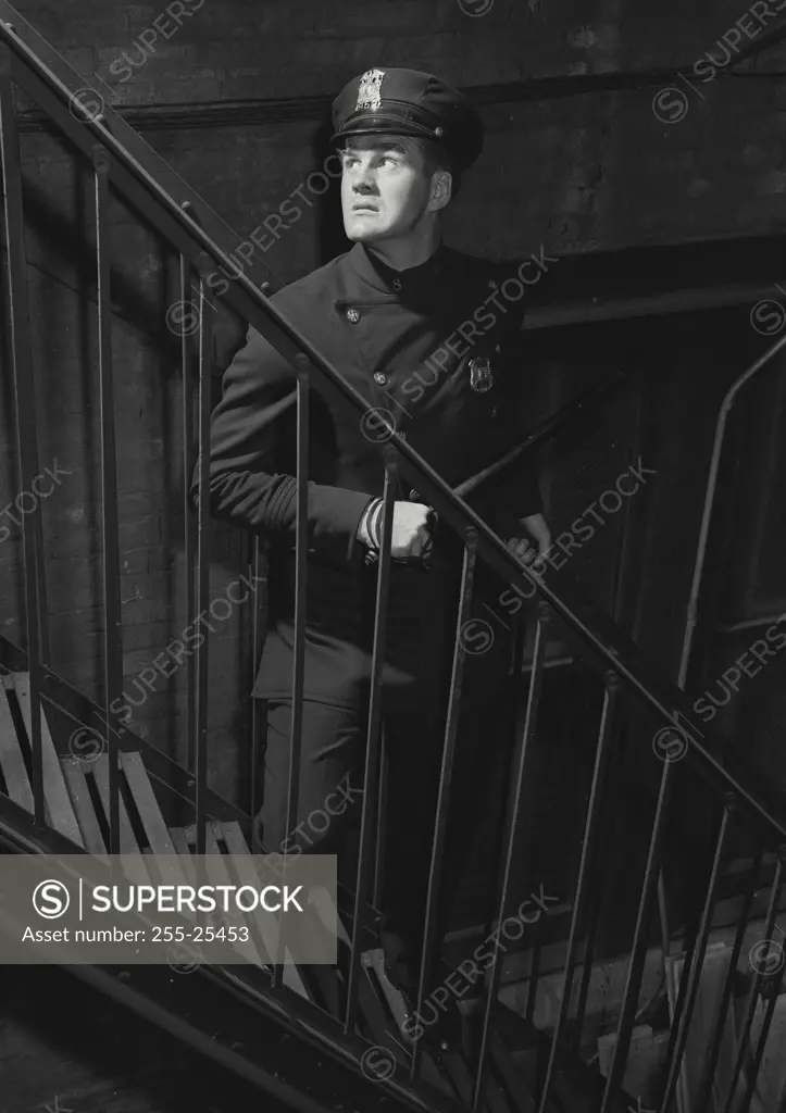 Vintage Photograph. Police officer lurking in fire escape. Frame 4