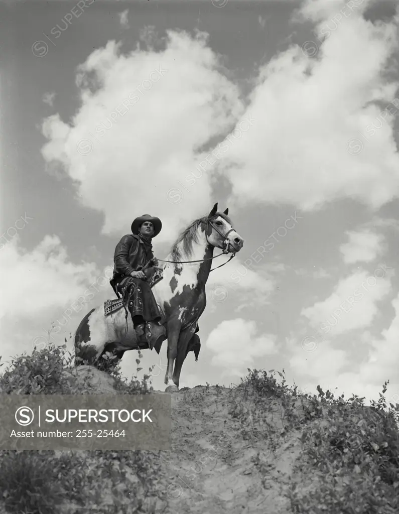 Vintage Photograph. Man riding horse inside field. Frame 18