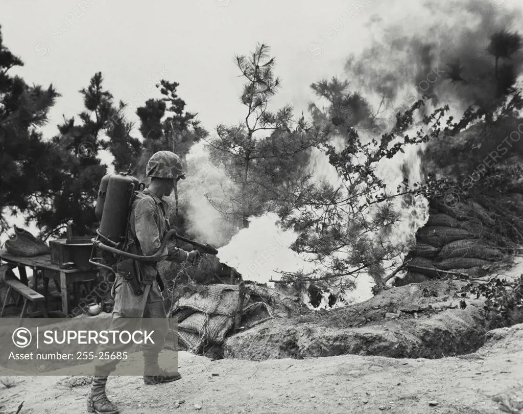 Vintage photograph. US Marine using flamethrower to burn out the enemy position on Wolmi island, Gateway to Inchon