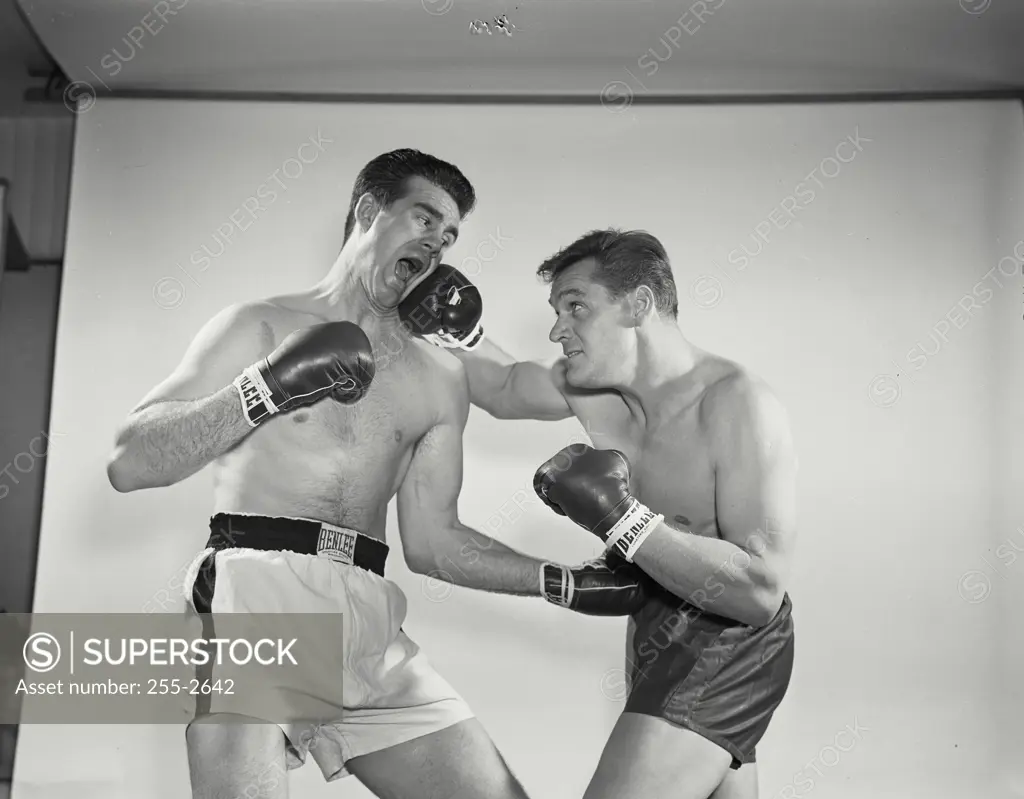 Vintage Photograph. Boxers wearing gloves in brawl. Frame 6